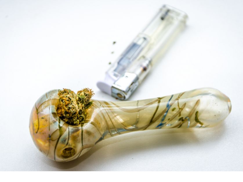 smoking cannabis through a pipe 