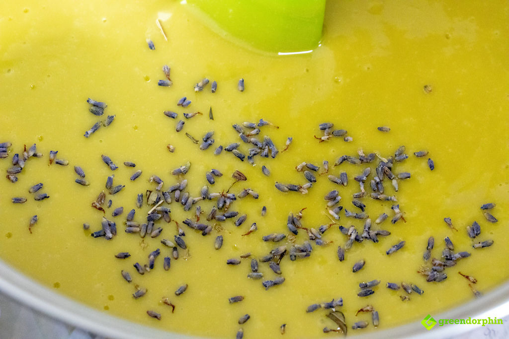 adding dry herbs to soap mixture