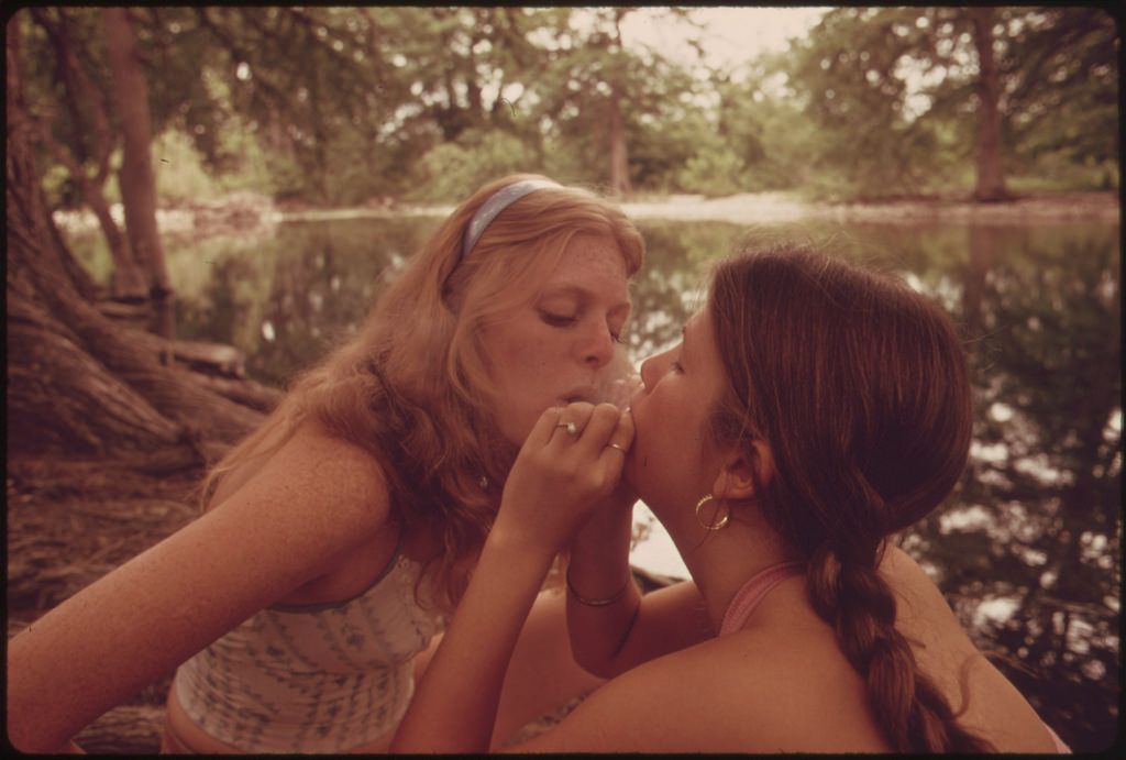 Two Girls Smoking Pot During an Outing in Cedar Woods near Leakey, Texas