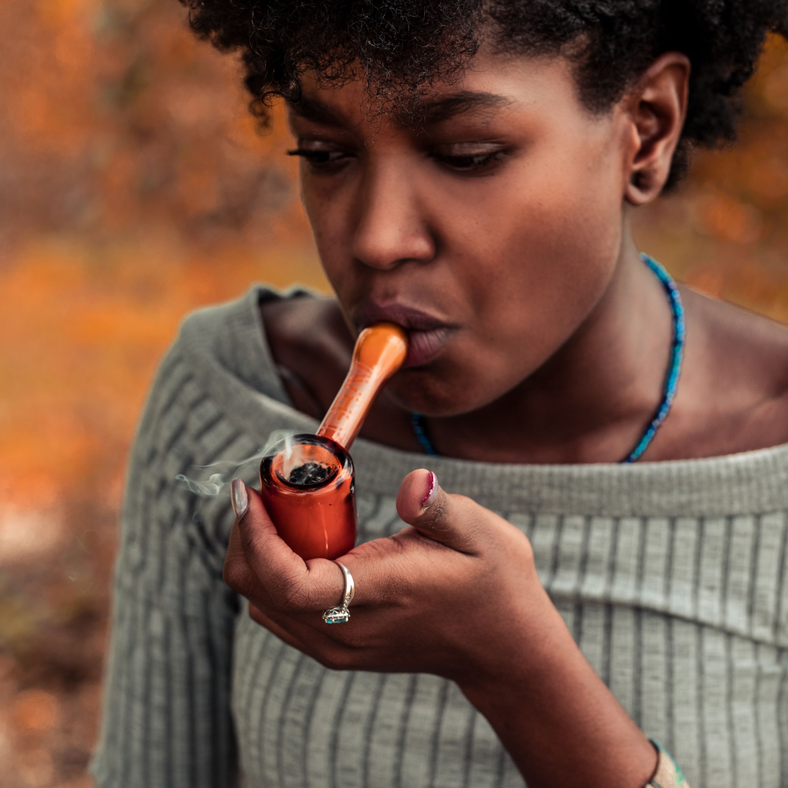 smoking cannabis using a weed pipe