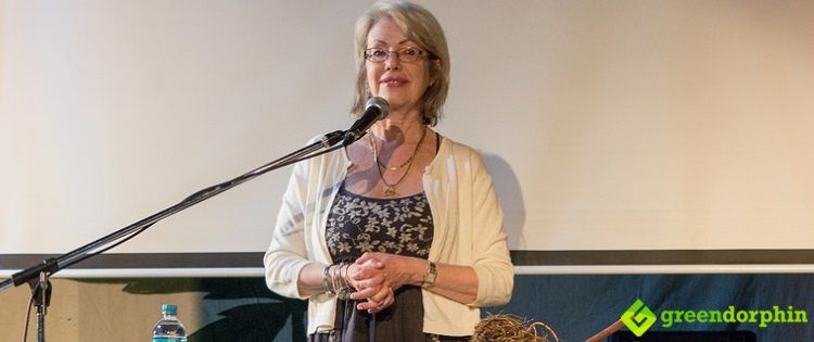 Sita von Windheim, from CannaMed, Vancouver demonstrating cannabis roots extraction on stage at the 25th MardiGrass in Nimbin