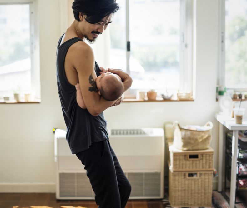 man holding a baby